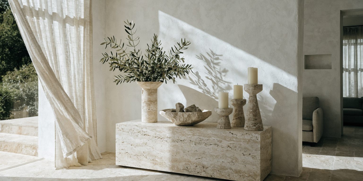 A sunlit living room styled with ELUMA stone objects